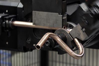 Making coffee machine components with coil-fed tube bending machines and end-forming machines.